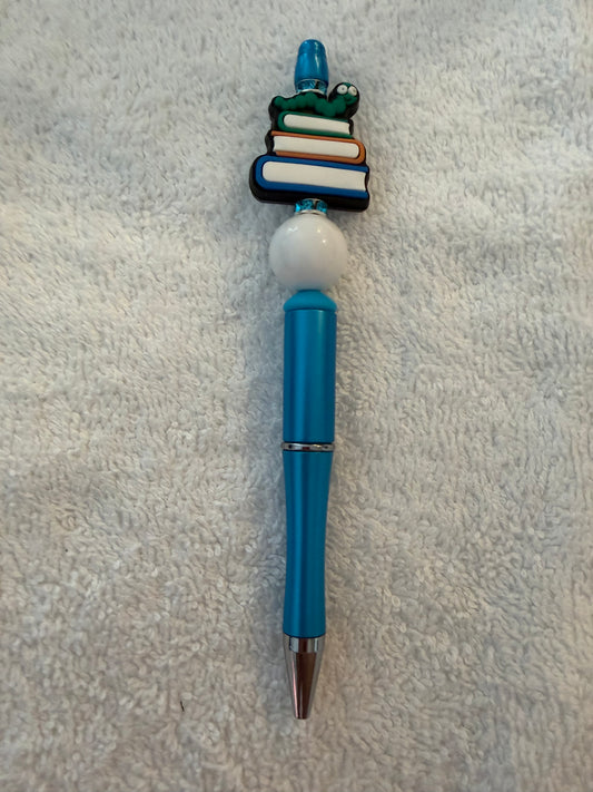 Stack of books pen