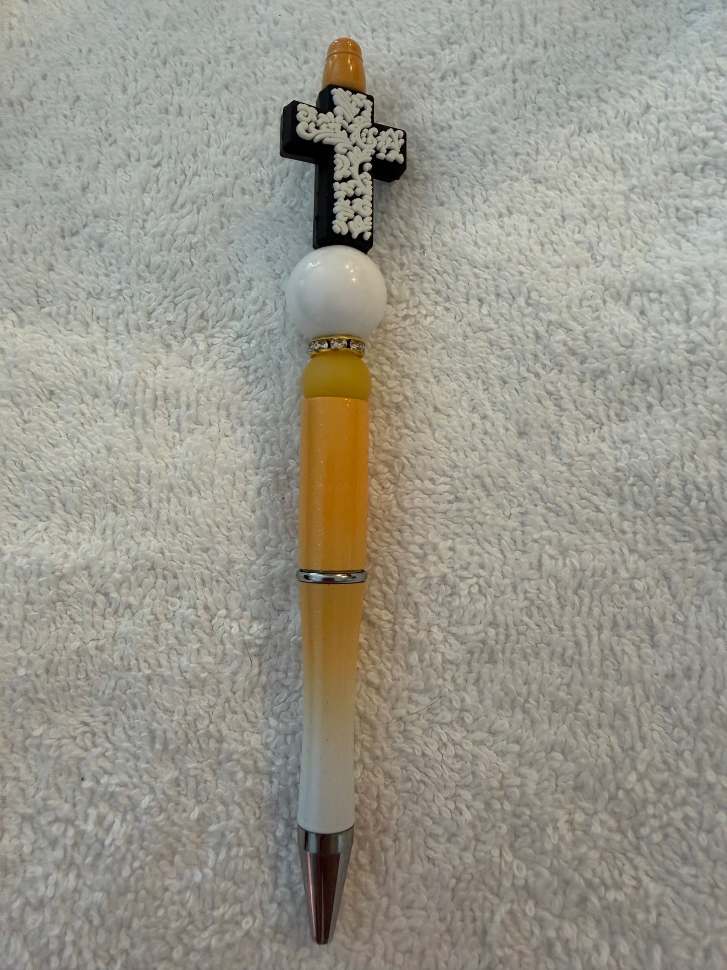 White cross pen
